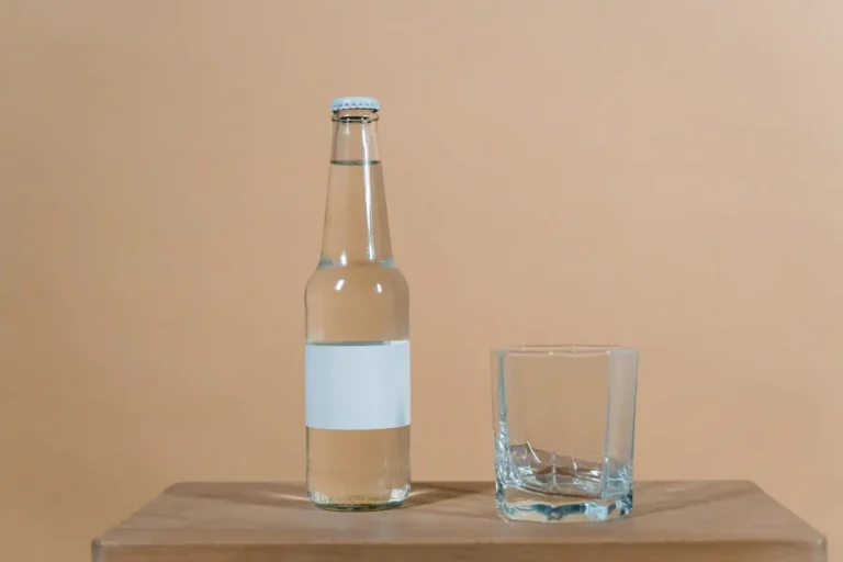 Empty Glass and Bottle with No Label